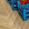 spc-herringbone-flooring-quick-step-ciro-botanic-beige SPC herringbone flooring Quick-Step Ciro Botanic Beige installed on floor and strawberry's and jam in the boxes