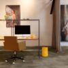 vinyl-tile-flooring-quick-step-oro-oxidized-rock Vinyl Tile flooring Quick-Step Oro Oxidized rock installed on a home office floor. Orange office stool, office working table, paintings on wall.